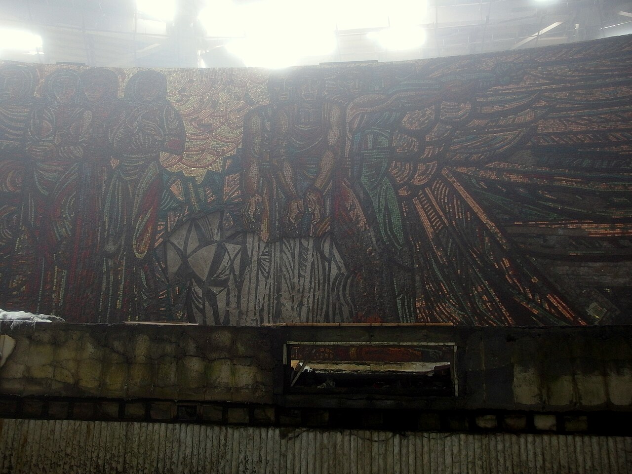 The interior of the Buzludzha Monument, where Kirov's 8×3-metre stone-and-smalt mosaic 'April Uprising' still dominates 