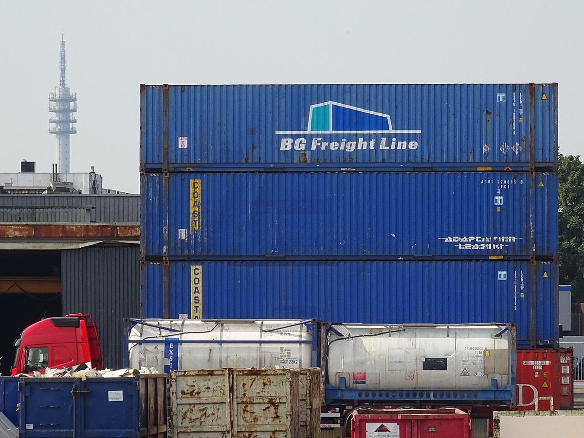 Stacked shipping containers at the Port of Rotterdam, the kind of container handling involved in UK-to-Bulgaria sea freight