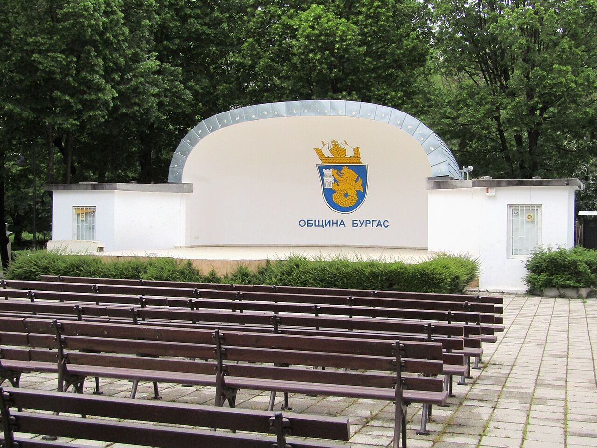 The open-air stage in the Sea Garden, Burgas, with a flat seafront promenade leading toward the Black Sea